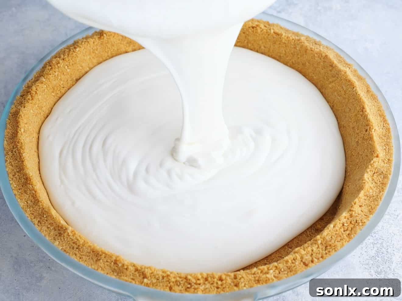 Toasted Marshmallow Ice Cream Pie 7 pouring ice cream filling into pie crust