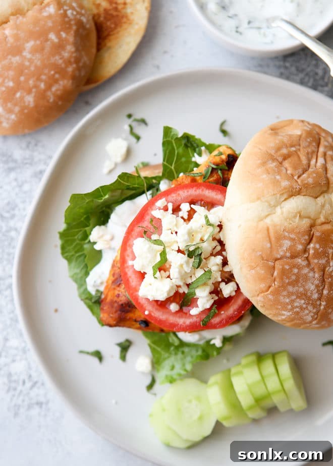Assembling a delicious chicken shawarma sandwich with fresh toppings