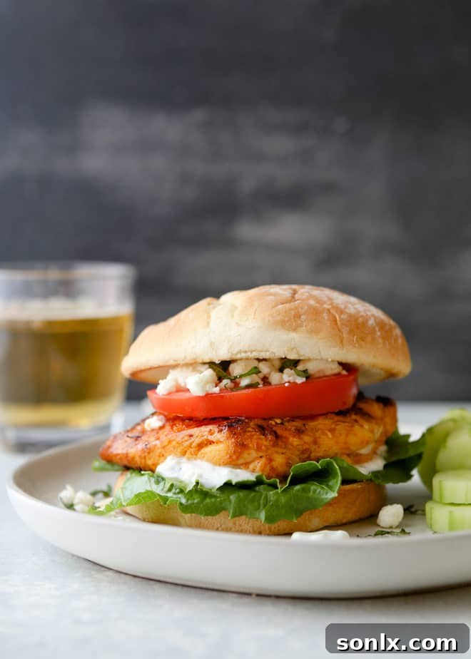 Close-up of a finished chicken shawarma sandwich with feta and tzatziki