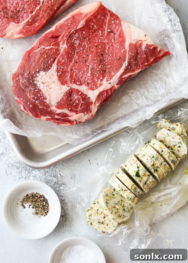 Ingredients needed for ribeye steaks with cowboy butter laid out
