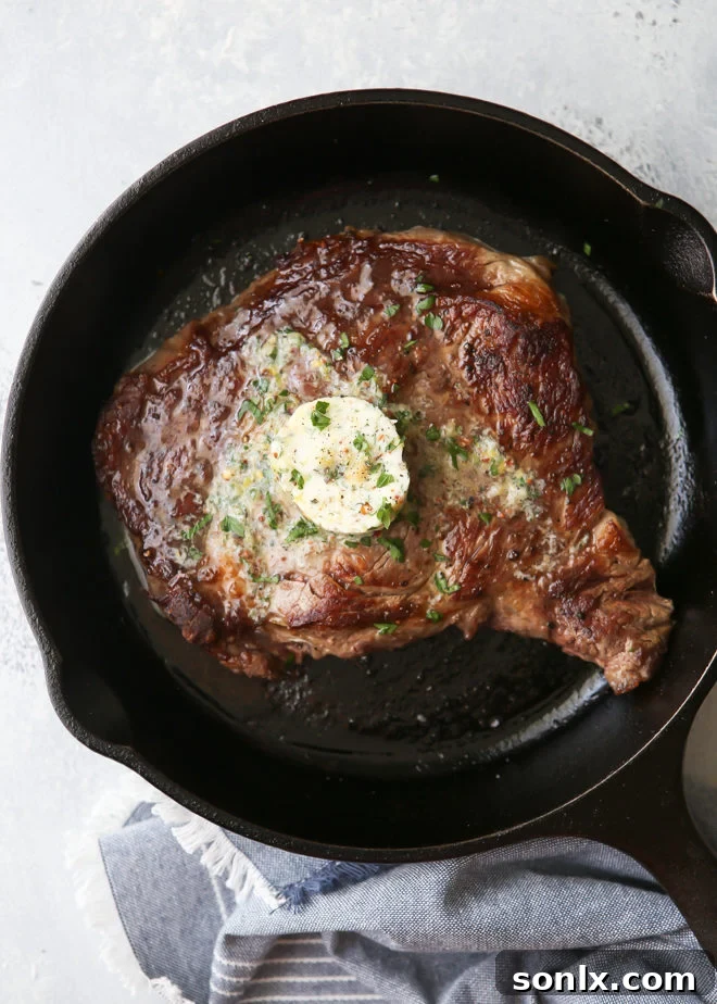 Close-up of grilled ribeye steaks with melting cowboy butter
