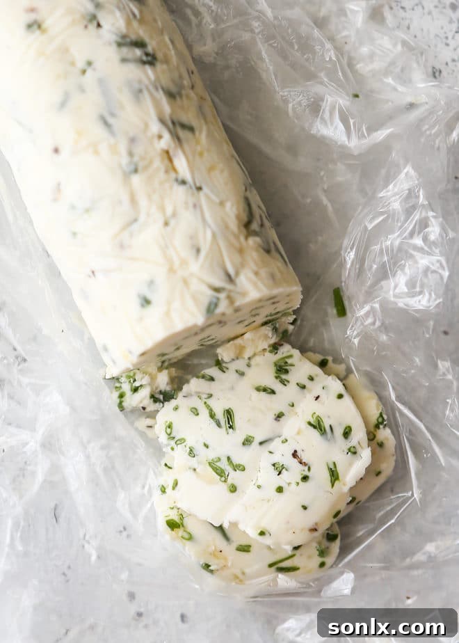 Close-up of freshly made chive compound butter in a log shape