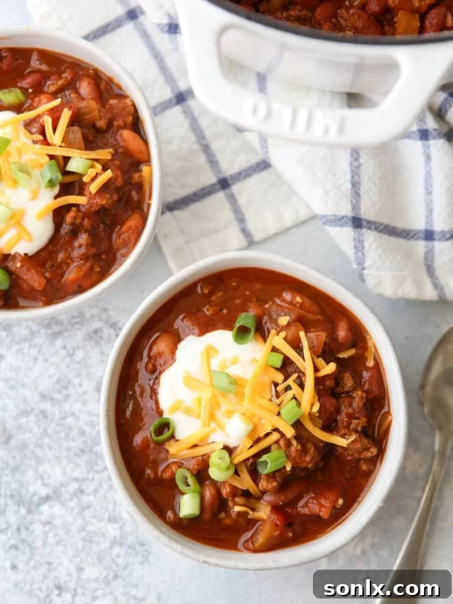 bowls of chili with a spoon