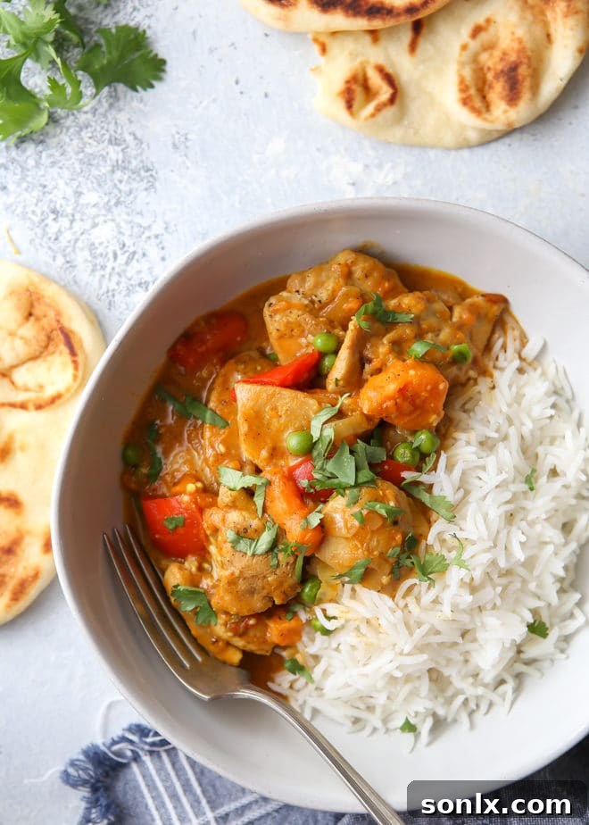 Tender chicken and creamy coconut korma in a pressure cooker
