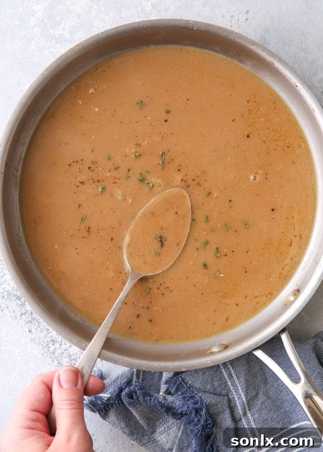 Homemade turkey gravy made from pan drippings is a must for Thanksgiving!