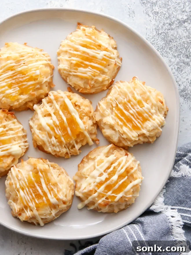 Sunny and delicious tropical pineapple coconut macaroons arranged beautifully on a plate.
