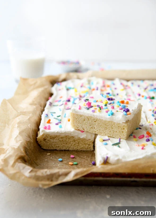 These soft sugar cookie bars with buttercream frosting are the perfect treats for a crowd!