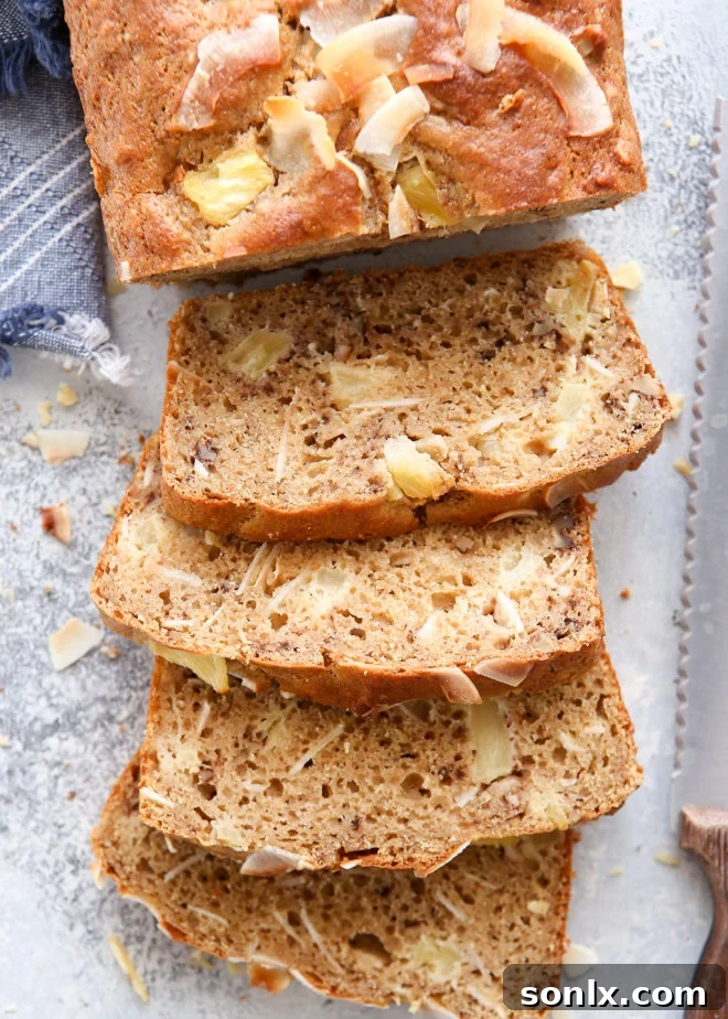 Lightened-up pineapple coconut bread, a healthy and flavorful tropical treat.