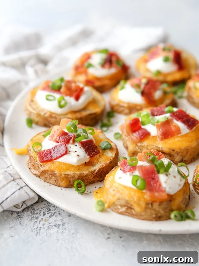 Irresistible loaded baked potato bites topped with cheese, sour cream, bacon, and chives