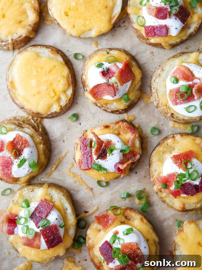 Assembling loaded baked potato bites with sour cream, bacon, and chives
