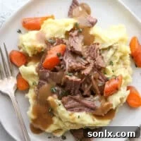 This classic pot roast recipe cooked in the slow cooker is fall-apart tender and full of so much flavor.