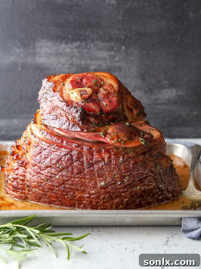 This honey-butter glazed ham recipe made with honey, butter, garlic, and rosemary is sweet and flavorful and only requires a few minutes of prep!