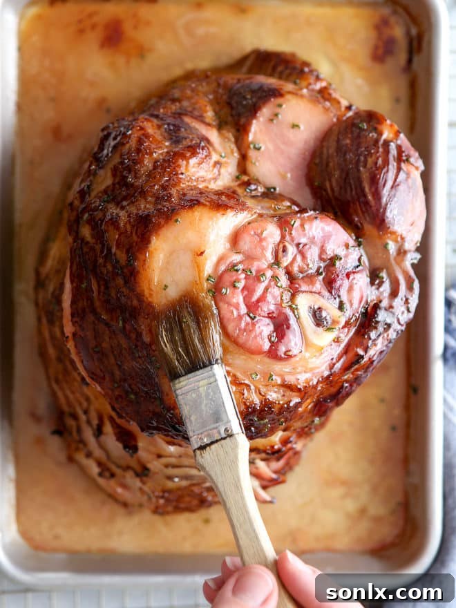 This honey-butter glazed ham recipe made with honey, butter, garlic, and rosemary is sweet and flavorful and only requires a few minutes of prep!