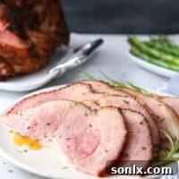 This honey-butter glazed ham recipe made with honey, butter, garlic, and rosemary is sweet and flavorful and only requires a few minutes of prep!