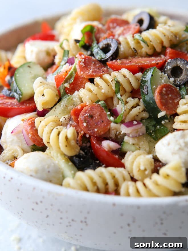 A large bowl of the delicious Italian pasta salad, ready for serving.