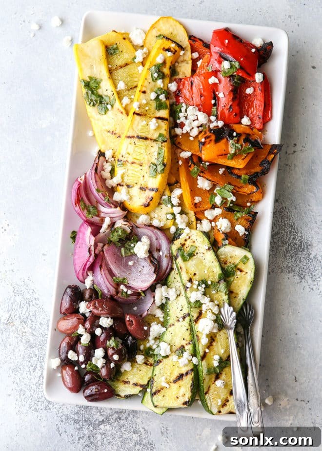 This grilled vegetable antipasto platter of zucchini, summer squash, red onion, bell peppers caramelized on the grill and served with kalamata olives, goat cheese and basil dressing is exactly what your next summer dinner party needs!