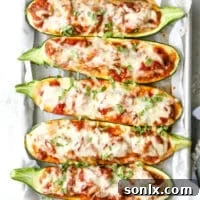 These sausage stuffed zucchini boats are cheesy and delicious, and have my whole family's stamp of approval.