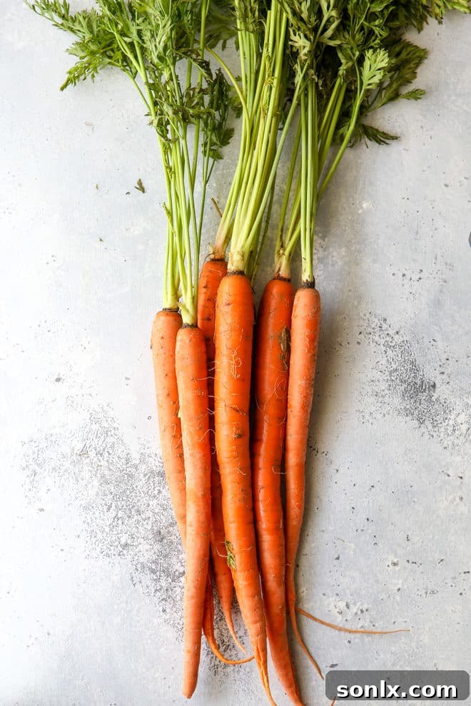 Close-up of fresh, vibrant carrots ready for preparation.