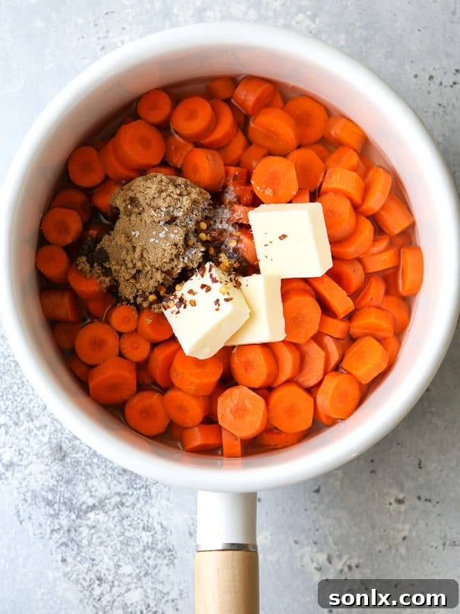 A selection of fresh ingredients including carrots, butter, and brown sugar, ready for glazing.