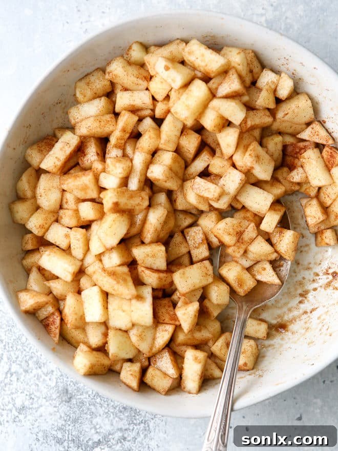Freshly chopped cinnamon scented apples ready for baking