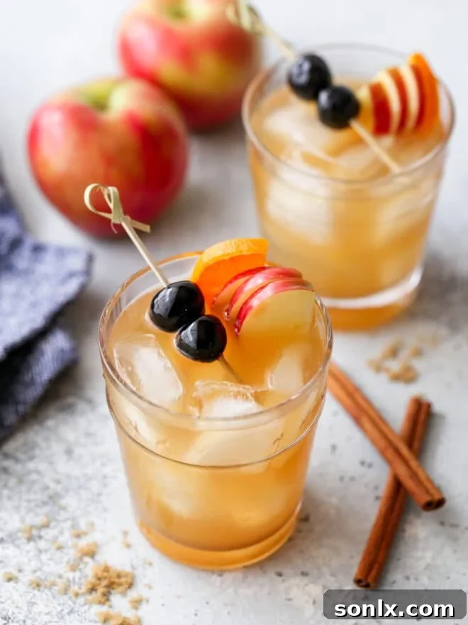 apple cider old fashioned in a glass, ready to be enjoyed
