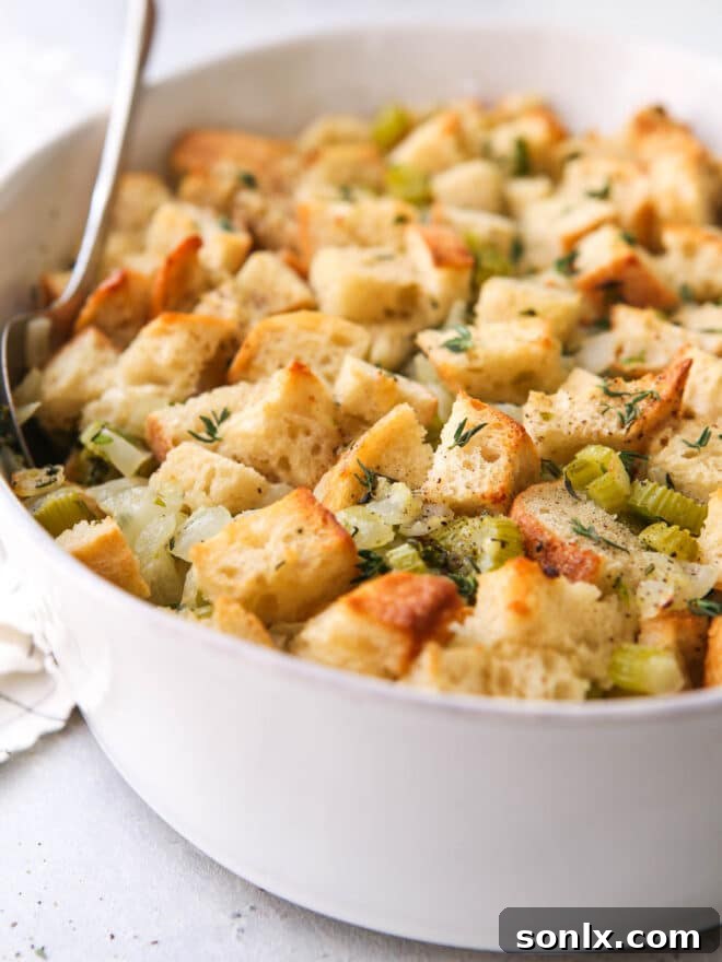 Close-up of baked classic stuffing, showing the golden-brown crust and moist interior.