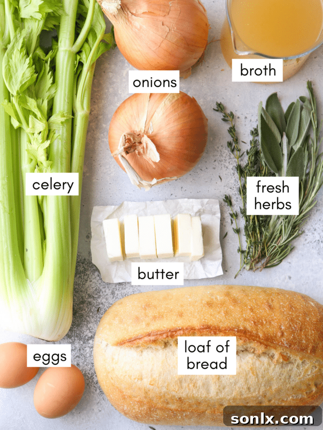 A flat lay of fresh ingredients for classic stuffing: bread, butter, onions, celery, herbs, broth, and eggs.
