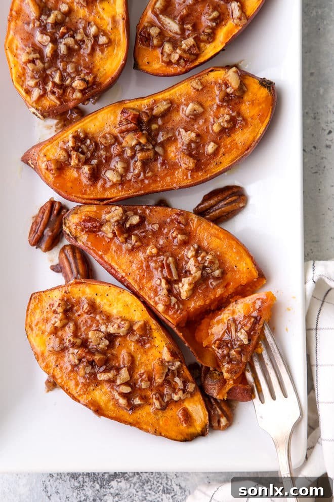 A beautifully presented serving of roasted sweet potatoes with maple pecan sauce, ready to be enjoyed.