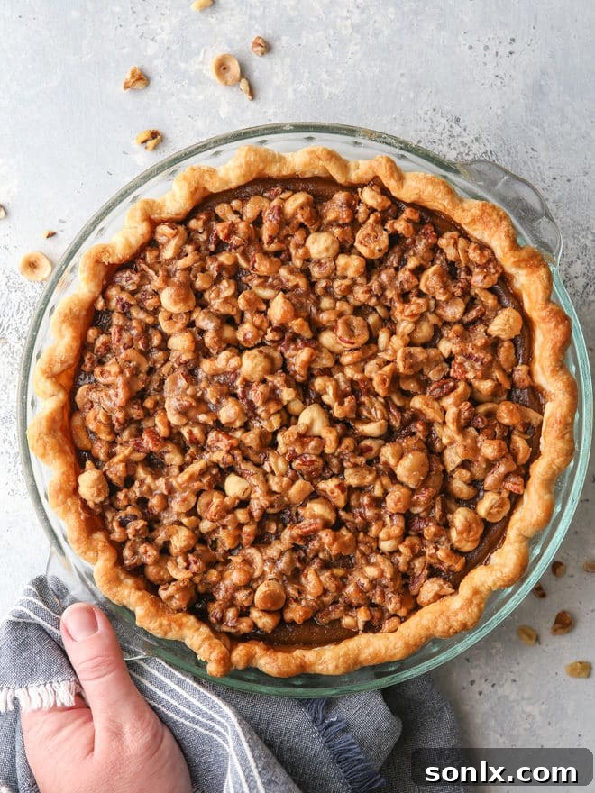 Pumpkin pie with nut praline is a delicious twist on the classic that's perfect for your holiday table!