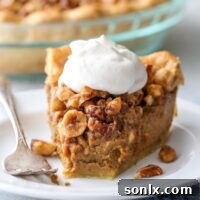 Pumpkin pie with nut praline is a delicious twist on the classic that's perfect for your holiday table!