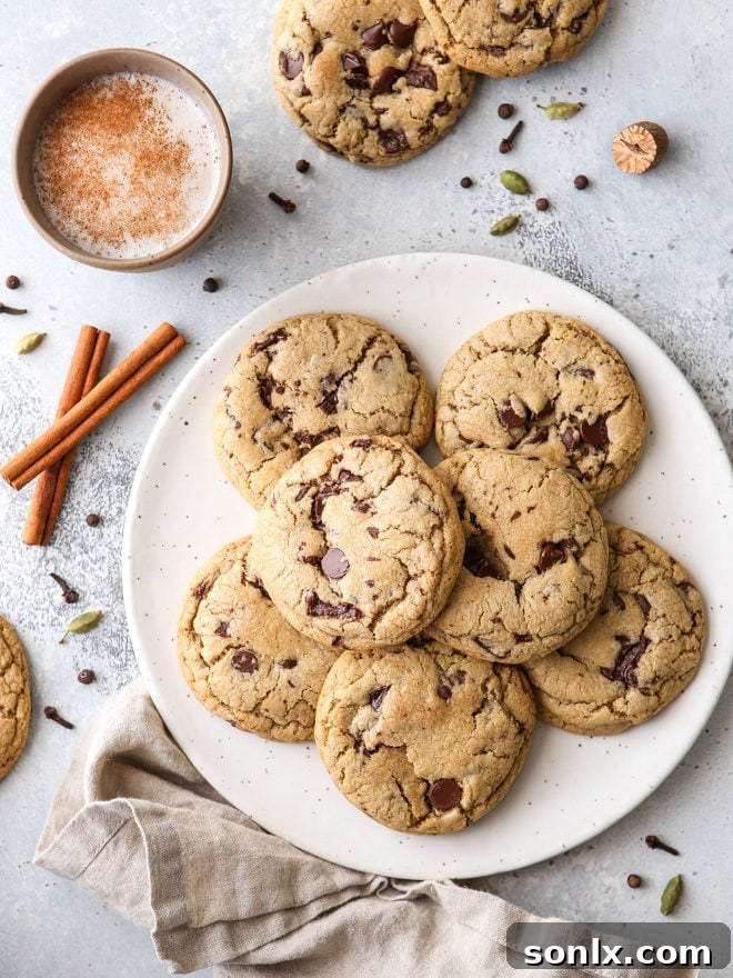 Thick, chewy chai spice chocolate chip cookies loaded with dark chocolate and warm spices like cardamom, ginger, nutmeg, cinnamon, cloves and allspice.