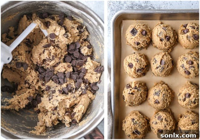 Chai spice chocolate chip cookie dough portions arranged on a baking sheet, ready for baking.