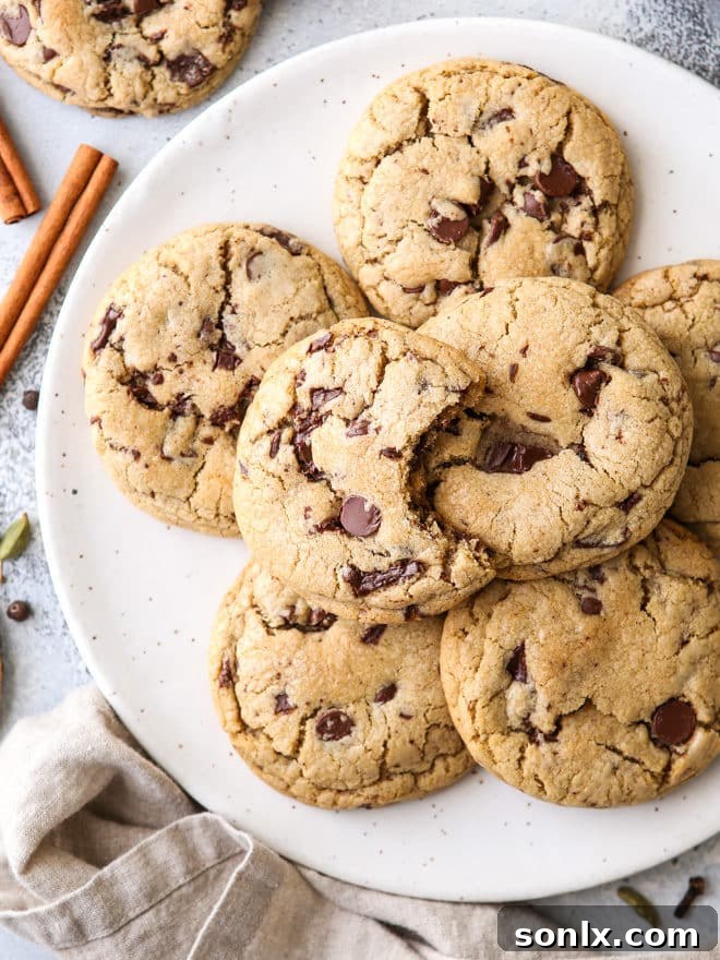Close-up of a chai spice chocolate chip cookie, showcasing its chewy interior and melted chocolate chunks.