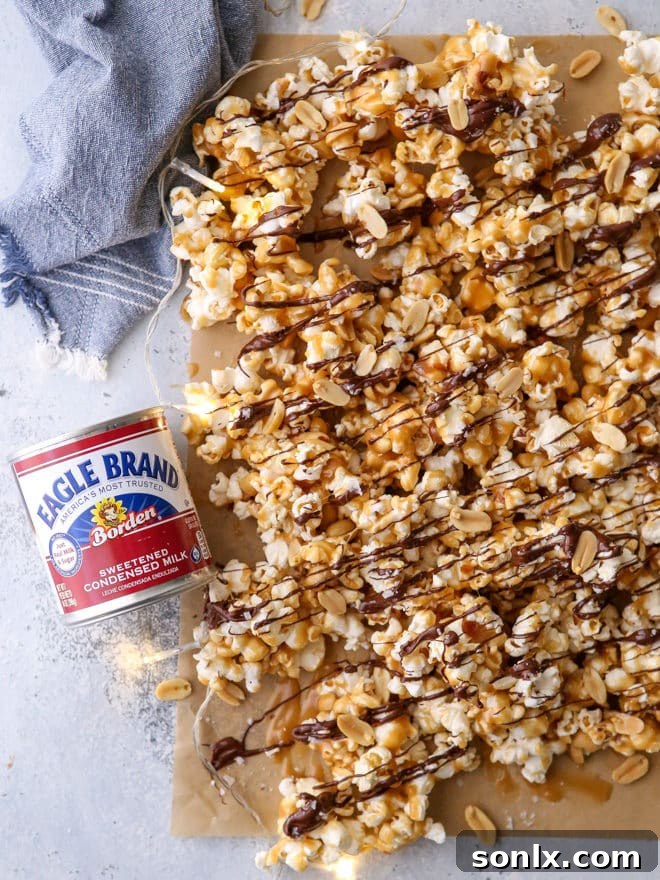 This big batch of chocolate caramel corn, featuring chewy caramel corn, roasted peanuts, a decadent drizzle of dark chocolate, and a delicate sprinkling of flaky salt, is the ultimate crowd-pleaser for any holiday party or gathering.