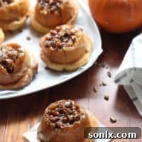 Delicious Pumpkin Sticky Buns dripping with caramel