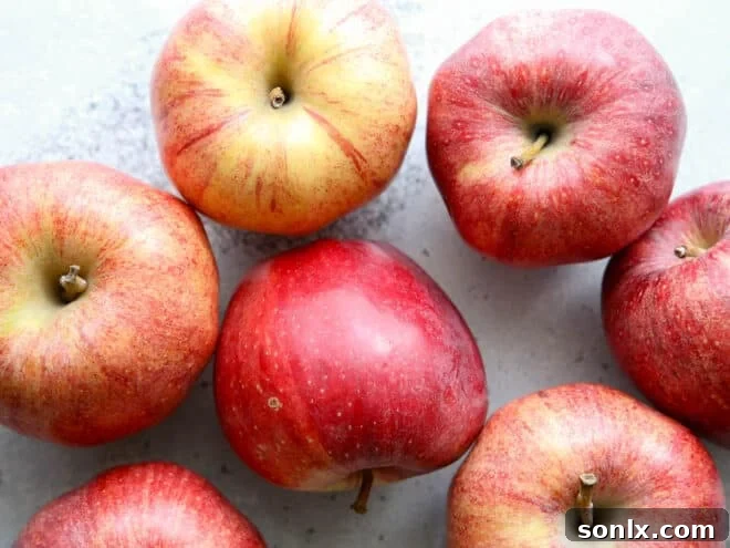 Fresh, vibrant green apples, ready to be peeled and sliced for a delicious pie filling.