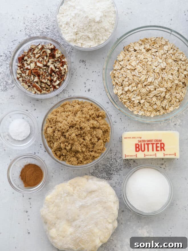 Various baking ingredients, precisely measured and arranged on a counter, ready for apple crumble pie preparation.
