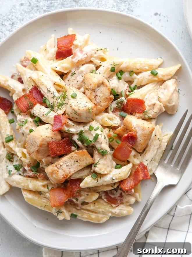 Delicious and easy chicken bacon ranch pasta, a family-friendly weeknight meal with creamy sauce and fresh herbs.