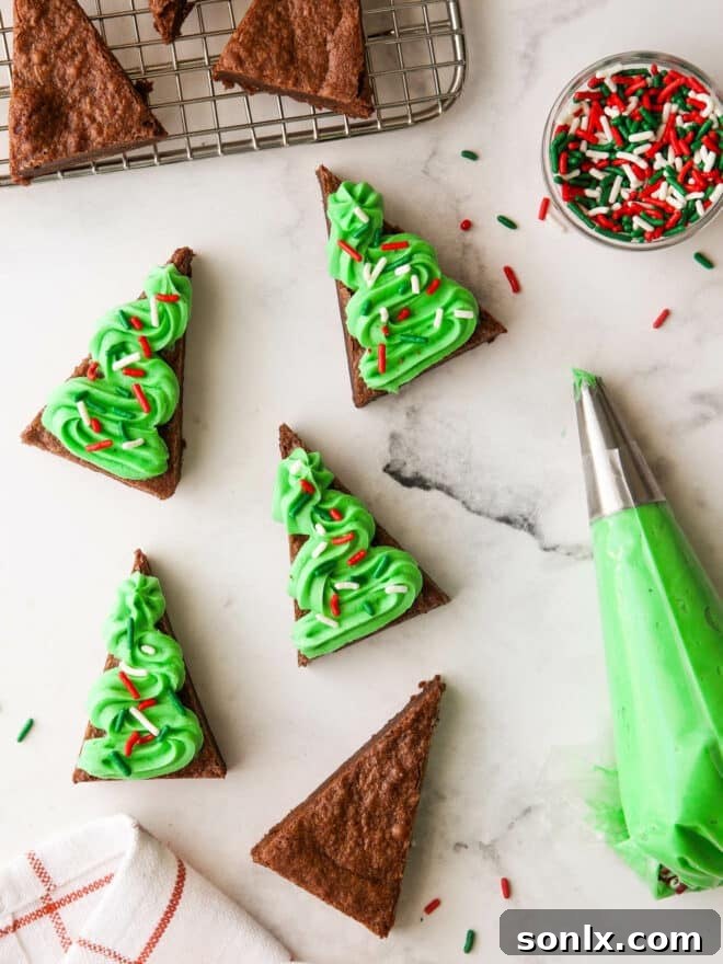 A detailed diagram showing how to cut a rectangular brownie slab into multiple triangle shapes to resemble Christmas trees.