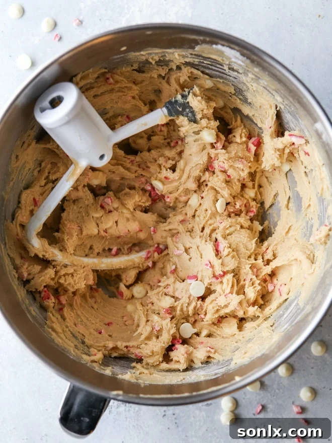 Peppermint white chocolate chip cookie dough, ready to be baked into festive treats