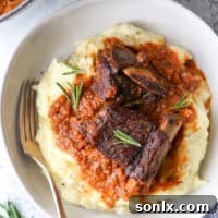 Beer braised short ribs are the ultimate comfort food, served with mashed potatoes.