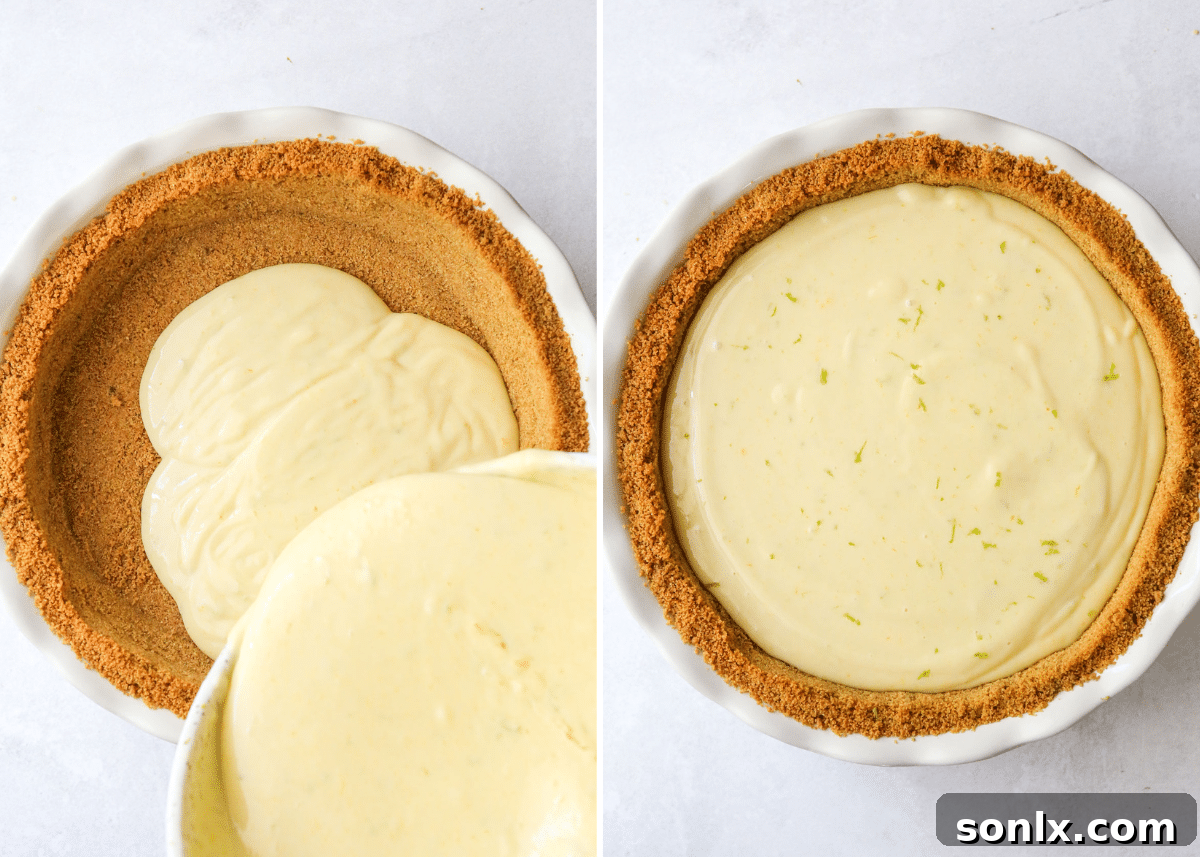 Pouring the vibrant green key lime pie filling into the golden-brown graham cracker crust in a pie pan.