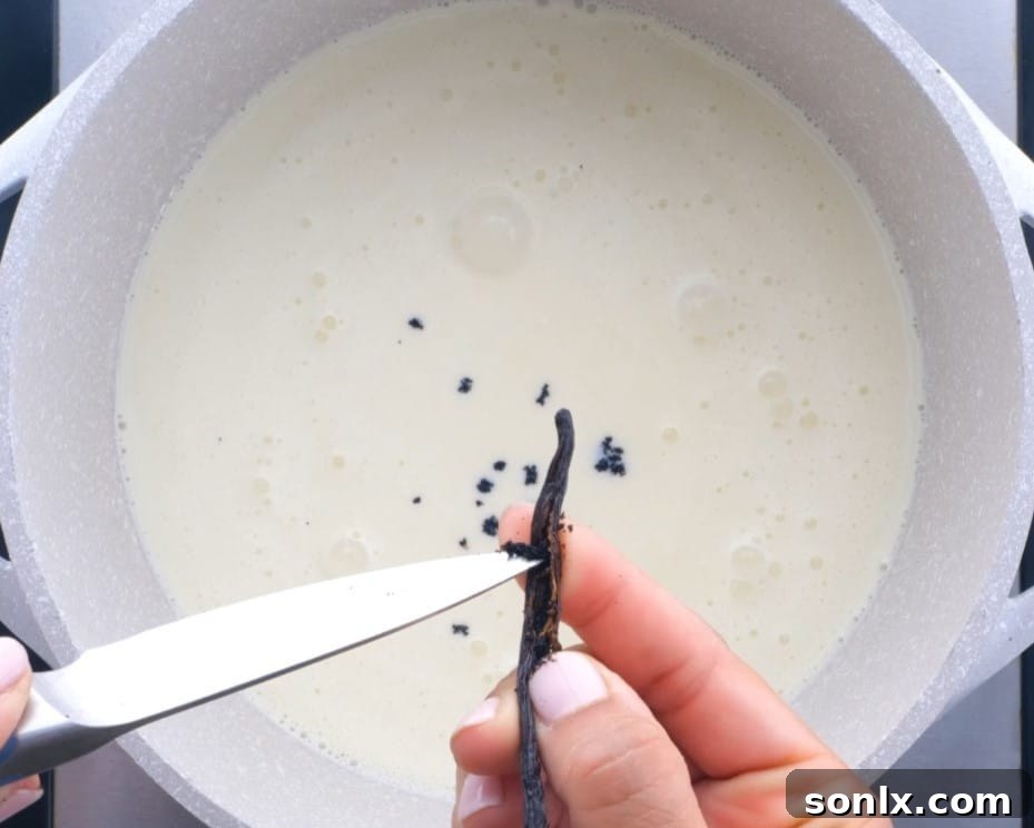 scraping vanilla bean into cream