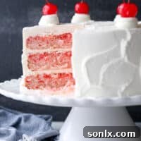 A beautiful homemade cherry chip cake, smothered in a fluffy whipped vanilla buttercream, making it a perfect celebration cake!