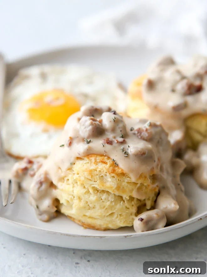 Flaky buttermilk biscuits with homemade sausage gravy is a breakfast no one can resist!