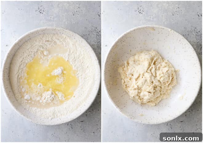 Close-up of hands mixing fry bread dough in a bowl, showing the shaggy texture as ingredients combine.