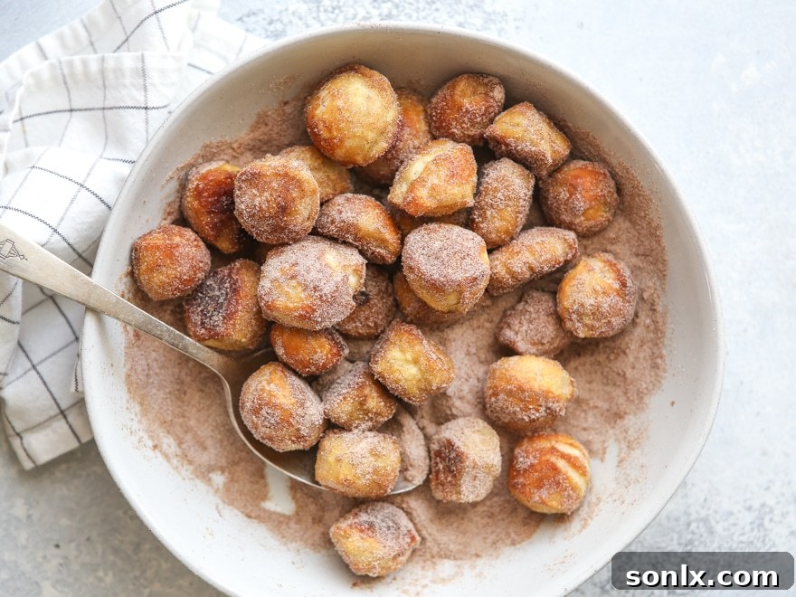 Coat pretzel bites with butter and cinnamo-sugar