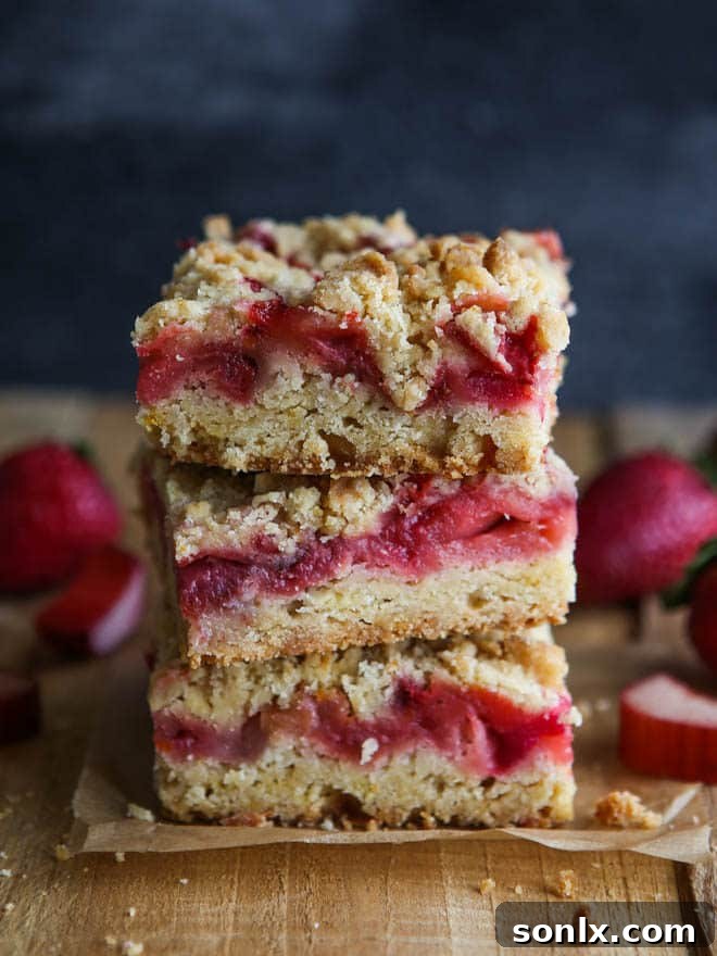 Delicious Strawberry Rhubarb Crumb Bars, showcasing a golden crumb top and fruit filling, perfect for spring.