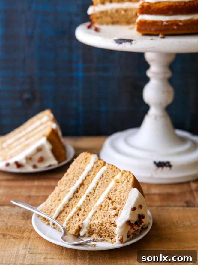 Sweet Potato Spice Cake with caramel drizzle and candied pecans on top.