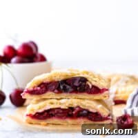 cherry hand pies cut in half and stacked